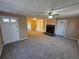 Living room with fireplace, built-in shelving and new carpet at 1613 Gilston Ct, Decatur, GA 30032