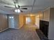 Living room with fireplace, built-in shelving and ceiling fan at 1613 Gilston Ct, Decatur, GA 30032