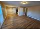 Hardwood floor living room with access to kitchen and other rooms at 1613 Gilston Ct, Decatur, GA 30032