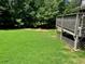 Spacious backyard with large deck and lush lawn at 208 Hickory Rdg, Cumming, GA 30040