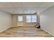 Finished basement with wood-look floors and plenty of natural light at 208 Hickory Rdg, Cumming, GA 30040