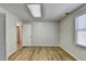 Well-lit basement room with wood-look floors at 208 Hickory Rdg, Cumming, GA 30040