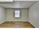 Bright basement room featuring wood-look floors at 208 Hickory Rdg, Cumming, GA 30040