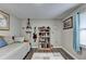 Cozy bedroom with a daybed, built-in shelves, and guitar decor at 208 Hickory Rdg, Cumming, GA 30040