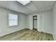 Simple bedroom with wood-look floors and a closet at 208 Hickory Rdg, Cumming, GA 30040