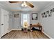 Spacious bedroom featuring wood-look floors and a ceiling fan at 208 Hickory Rdg, Cumming, GA 30040