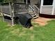 Back deck with stairs and grill, leading to backyard at 208 Hickory Rdg, Cumming, GA 30040