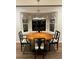 Bright dining room with an oval table and six chairs at 208 Hickory Rdg, Cumming, GA 30040