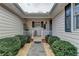 Inviting front porch with white railing and landscaping at 208 Hickory Rdg, Cumming, GA 30040