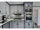 Modern kitchen with stainless steel appliances and corner sink at 208 Hickory Rdg, Cumming, GA 30040