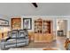 Living room featuring a recliner and built-in shelving at 208 Hickory Rdg, Cumming, GA 30040