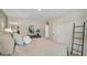 Bright bedroom with window, neutral tones, and a ladder at 2100 Moss Hill Rd, Stone Mountain, GA 30088