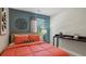 Bright bedroom with coral bedding and a built-in desk at 2100 Moss Hill Rd, Stone Mountain, GA 30088