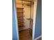 Well-organized closet with shelves and hanging rod at 2479 Peachtree Ne Rd # 1103, Atlanta, GA 30305