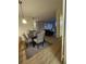 Open-concept living space with a dining area, showcasing modern decor, hardwood floors, and gray tones at 2479 Peachtree Ne Rd # 1103, Atlanta, GA 30305