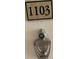 Apartment unit door with number 1103, peephole and door knocker at 2479 Peachtree Ne Rd # 1103, Atlanta, GA 30305