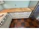 White kitchen cabinets with butcher block countertops at 2479 Peachtree Ne Rd # 1103, Atlanta, GA 30305