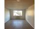 Bright living room with hardwood floors and large window at 2479 Peachtree Ne Rd # 1103, Atlanta, GA 30305