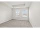 Bright bedroom with two windows and neutral carpet at 3816 Thatcher Sw Dr, Marietta, GA 30008