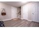 View of basement entry with grey flooring and white doors at 4196 Roswell Rd Ne, Atlanta, GA 30342