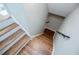 Elegant hardwood staircase leading down to the finished basement at 4196 Roswell Rd Ne, Atlanta, GA 30342