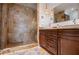 Large bathroom with double vanity, walk-in shower, and elegant tile at 4196 Roswell Rd Ne, Atlanta, GA 30342