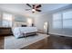 Bright main bedroom with hardwood floors and plantation shutters at 4196 Roswell Rd Ne, Atlanta, GA 30342