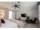 Spacious bedroom with large bed, TV, and comfortable seating area at 4196 Roswell Rd Ne, Atlanta, GA 30342