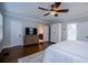 Main bedroom with hardwood floors, en-suite bathroom, and walk-in closet at 4196 Roswell Rd Ne, Atlanta, GA 30342