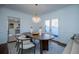 Bright dining room features a wood table, chandelier, and view into the kitchen at 4196 Roswell Rd Ne, Atlanta, GA 30342