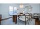 Elegant dining room with wood table and French doors at 4196 Roswell Rd Ne, Atlanta, GA 30342