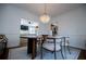 Spacious dining room with a stunning chandelier and views into the living room and kitchen at 4196 Roswell Rd Ne, Atlanta, GA 30342