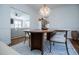 Elegant dining room with a large wood table and chandelier, open to living room at 4196 Roswell Rd Ne, Atlanta, GA 30342