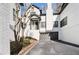 White brick townhouse exterior with attached garage and landscaping at 4196 Roswell Rd Ne, Atlanta, GA 30342