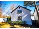 White house exterior with black windows and landscaping at 4196 Roswell Rd Ne, Atlanta, GA 30342