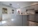 Modern kitchen with gray cabinets and a large island at 4196 Roswell Rd Ne, Atlanta, GA 30342