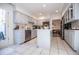 Open concept kitchen with stainless steel appliances and island at 4196 Roswell Rd Ne, Atlanta, GA 30342