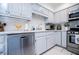 Modern kitchen with stainless steel appliances and white cabinets at 4196 Roswell Rd Ne, Atlanta, GA 30342