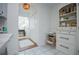 Well-equipped kitchen with white cabinets, a view of the hallway, and tile flooring at 4196 Roswell Rd Ne, Atlanta, GA 30342