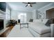 Living room with sectional sofa, hardwood floors, and a fireplace at 4196 Roswell Rd Ne, Atlanta, GA 30342