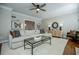 Bright living room featuring a sectional sofa and hardwood floors at 4196 Roswell Rd Ne, Atlanta, GA 30342