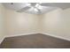 Spacious finished basement with laminate flooring and ceiling fan at 745 Glengate Pl, Atlanta, GA 30328