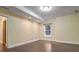 Bright basement room featuring hardwood floors and a large window at 745 Glengate Pl, Atlanta, GA 30328