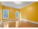 Spacious bedroom with hardwood floors and yellow walls at 745 Glengate Pl, Atlanta, GA 30328