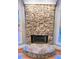 Stone fireplace with a large hearth in the Gathering room at 745 Glengate Pl, Atlanta, GA 30328