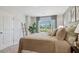 Spacious bedroom with large window and neutral color palette at 2102 Moss Hill Rd, Stone Mountain, GA 30088