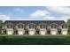 Tan townhouses with gray roofs and white garage doors at 2102 Moss Hill Rd, Stone Mountain, GA 30088
