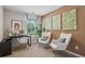 Bright home office features a window, desk, and two comfortable armchairs at 2102 Moss Hill Rd, Stone Mountain, GA 30088