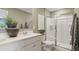 Bathroom with double vanity, shower, and modern fixtures at 2104 Moss Hill Rd, Stone Mountain, GA 30088