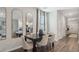 Bright dining room features a table with six chairs and large mirrors at 2104 Moss Hill Rd, Stone Mountain, GA 30088